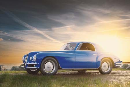 Classic blue car at sunset - Auto Insurance